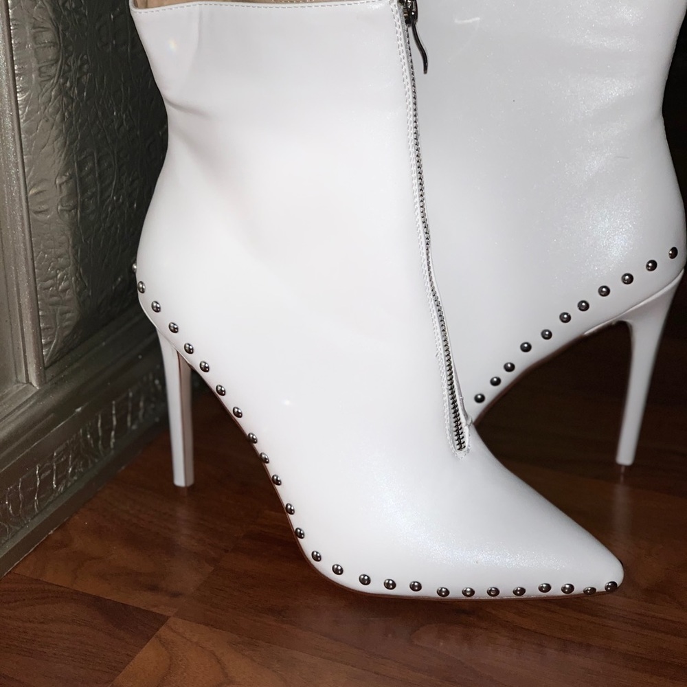 Mid calf zip up boots. brand new never worn .